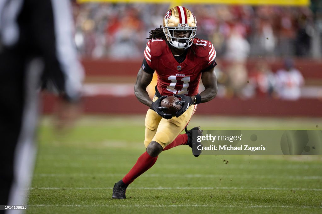 Brandon Aiyuk #11 of the San Francisco 49ers runs after making a catch during the NFC Divisional Playoff game against the Green Bay Packers at Levi's Stadium on January 20, 2024 in Santa Clara, California. (Photo by Michael Zagaris/San Francisco 49ers/Getty Images)