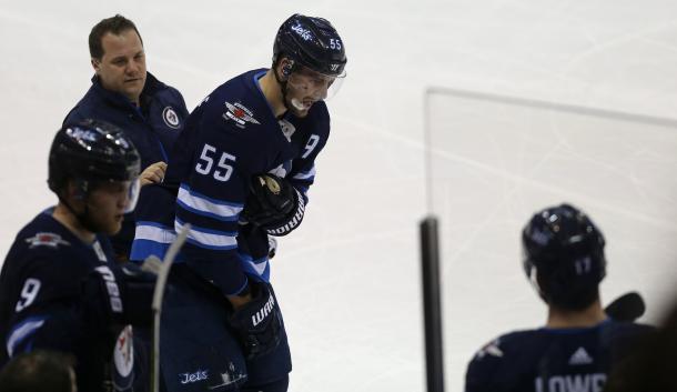 Mark Scheifele goes off with an upper body injury, decreasing the Jet's firepower. (Photo: Winnipeg Sun)