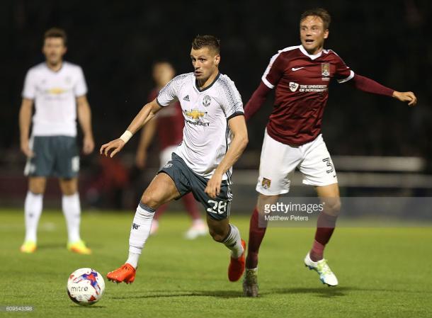 Morgan Schneiderlin in action during the EFL Cup Third Round match between Northampton Town and Manchester United. | Photo: Matthew Peters/Man Utd via Getty Images