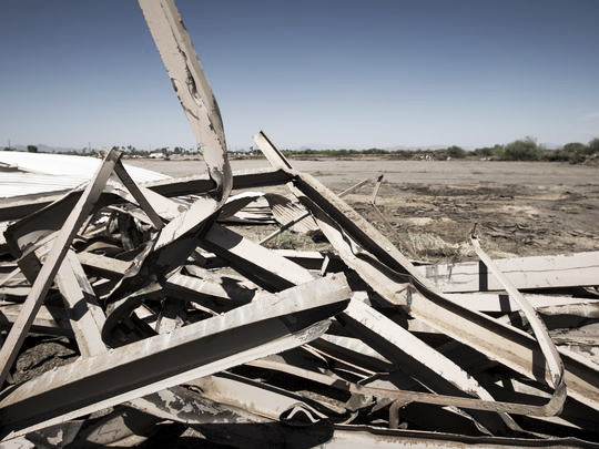 A pile of twisted metal is all that remains of a screen at the Scottsdale Six drive in-movie theater. The drive-in screens are being torn down to make way for development. (Photo: Charlie Leight/The Republic)