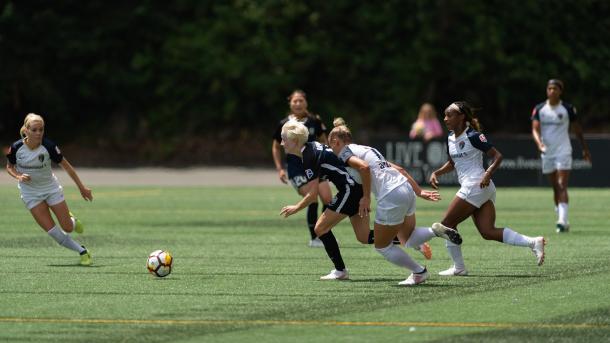 Dunn (19) and Mathias (11) chase down Megan Rapinoe. | Photo: Jane Gershovich - isiphotos.com​