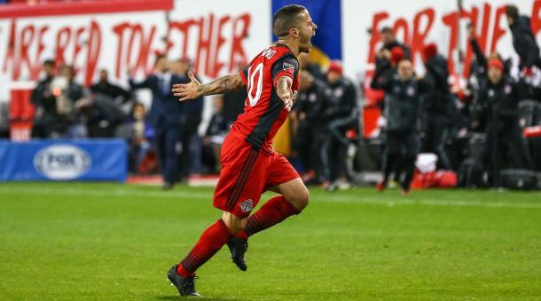 Sebastian Giovinco goes off to celebrate with the TFC fans after grabbing the lead for Toronto | Source: si.com