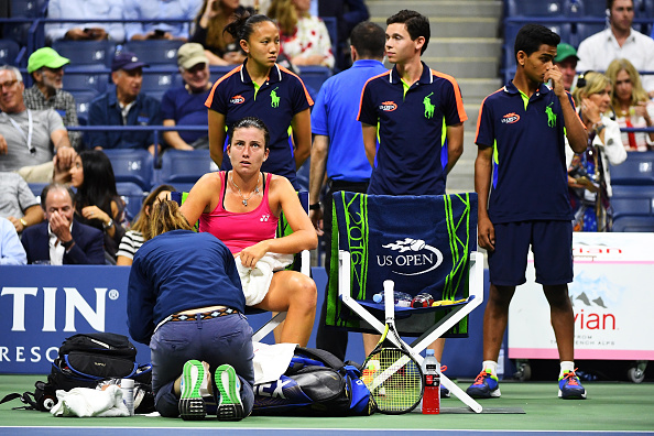 Sevastova receiving medical treatment on her ankle (Photo by Alex Goodlett / Getty Images)