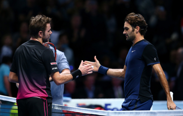Wawrinka (left) and Federer (right) shake hands after the latter's victory at last year's ATP World Tour finals in November. | Photo: Getty
