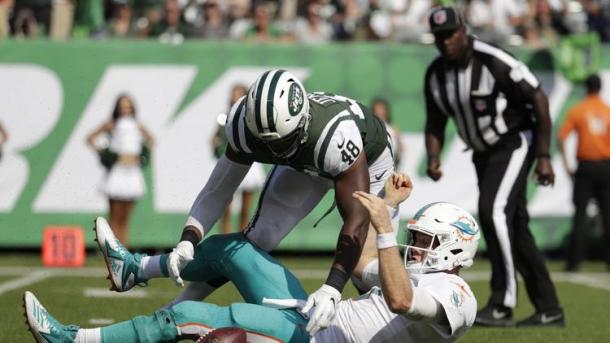 Jenkins forced Tannehill to fumble deep in Miami territory/Photo: Julio Cortez/Associated Press
