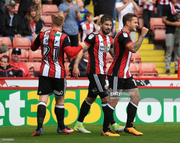 Billy Sharp (right) celebrates his goal against Barnsley | Photo: Getty/ Mark Cosgrove