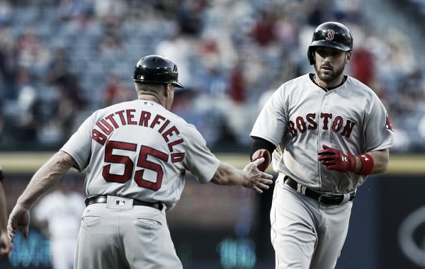 Travis Shaw (right) rounds the bases after hitting his home run in the top of the first inning against the Atlanta Braves. (Butch Dill/Getty Images North America)