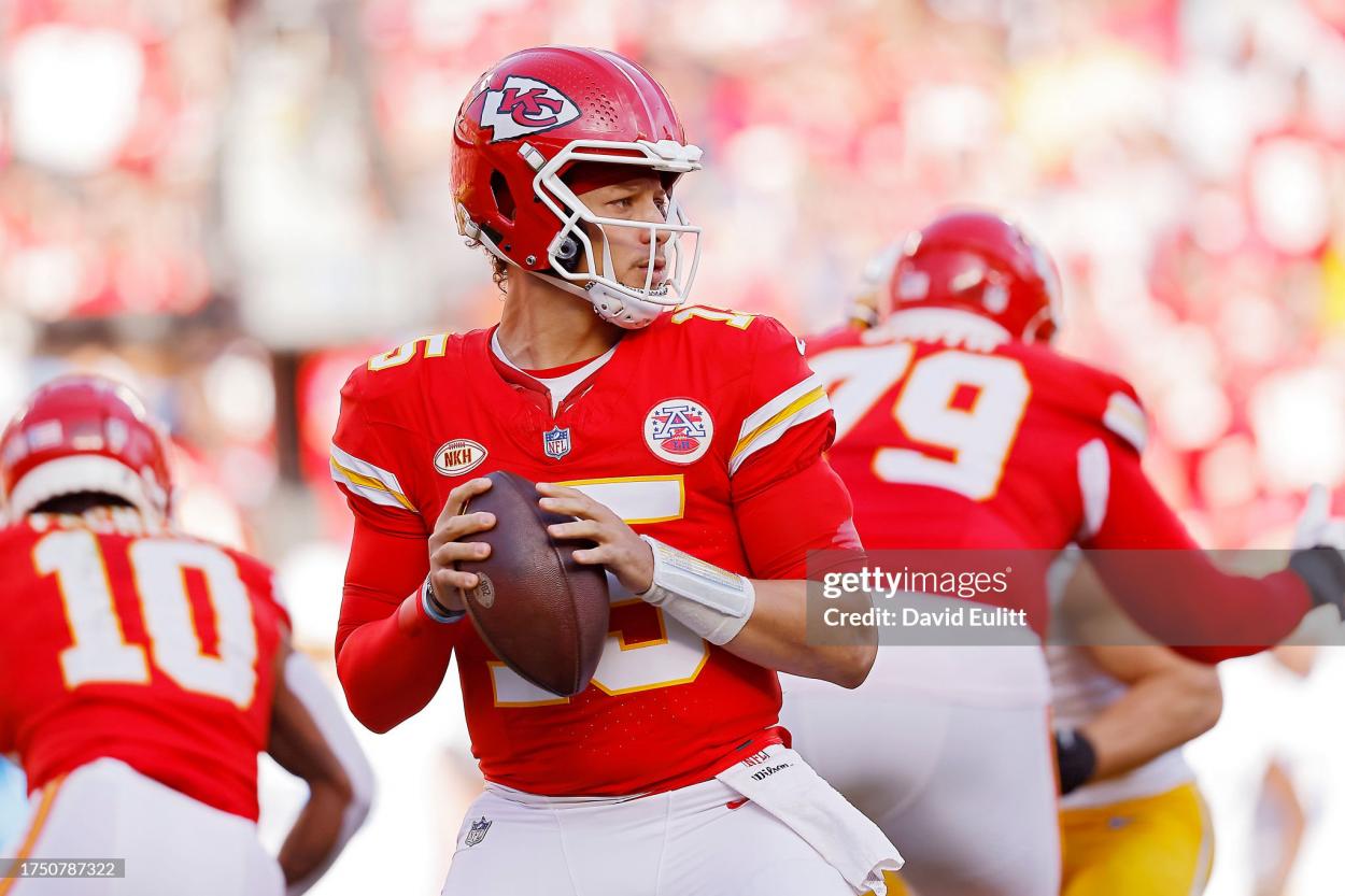 Patrick Mahomes #15 of the Kansas City Chiefs looks to pass against the Los Angeles Chargers during the first half of the game at GEHA Field at Arrowhead Stadium on October 22, 2023 in Kansas City, Missouri. (Photo by David Eulitt/Getty Images)