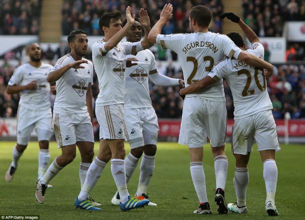 Swansea celebrate their goal (photo: Getty Images)