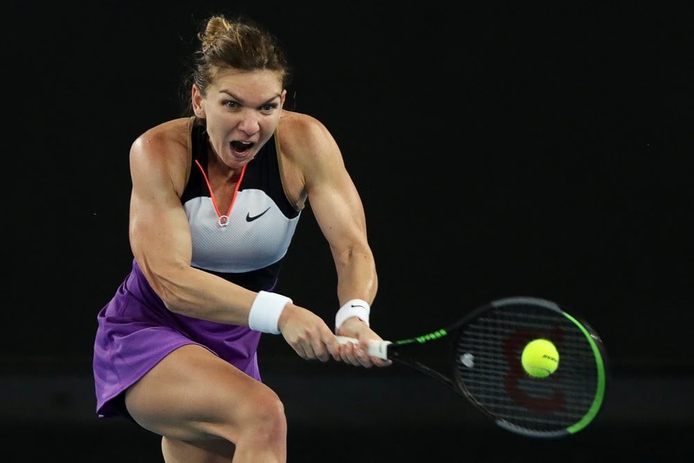 Halep reaches for a backhand in her comeback victory/Photo: AFP