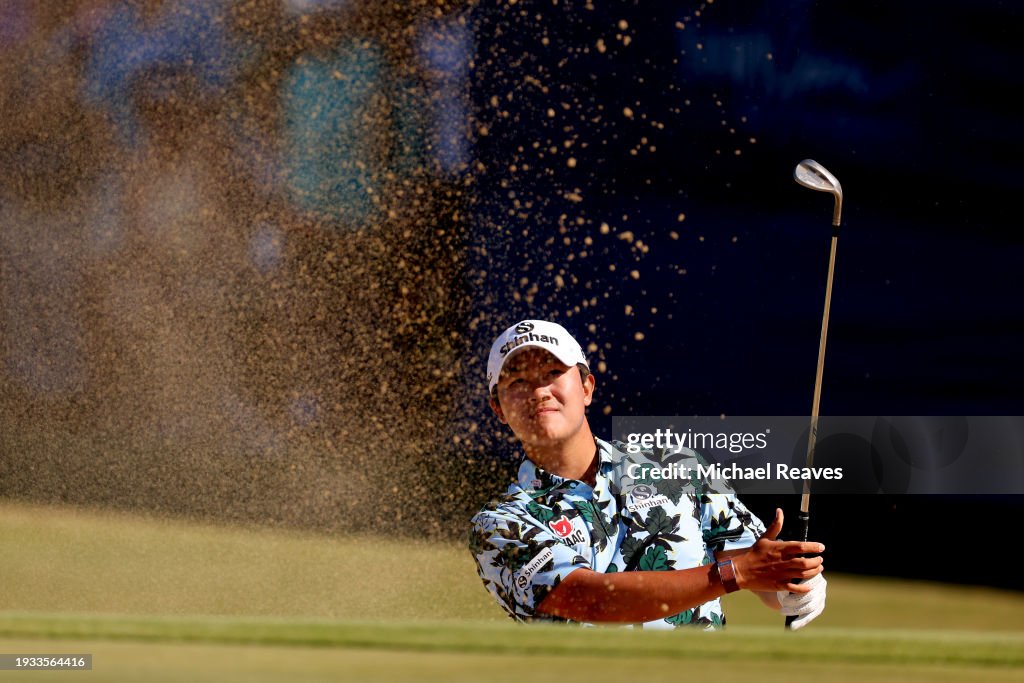 S.H. Kim of South Korea plays a shot from a bunker on the 18th hole during the final round of the Sony Open in Hawaii at Waialae Country Club on January 14, 2024 in Honolulu, Hawaii. (Photo by Michael Reaves/Getty Images)