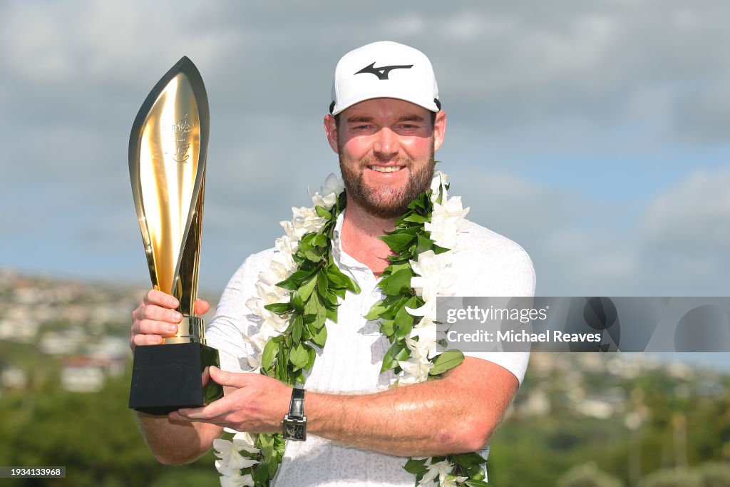 Grayson Murray of the United States poses with the trophy after winning the Sony Open in Hawaii on the first play-off hole at Waialae Country Club on January 14, 2024 in Honolulu, Hawaii. (Photo by Michael Reaves/Getty Images)