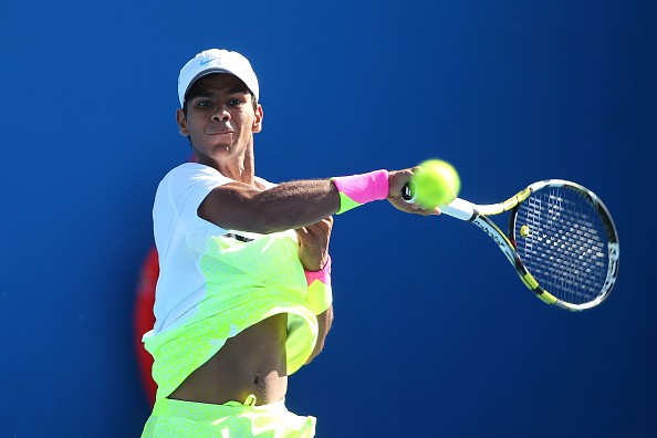 Sumit Nagal hits a forehand during boys’ singles action at the 2014 Australian Open. | Photo: Patrick Scala/Getty Images AsiaPac