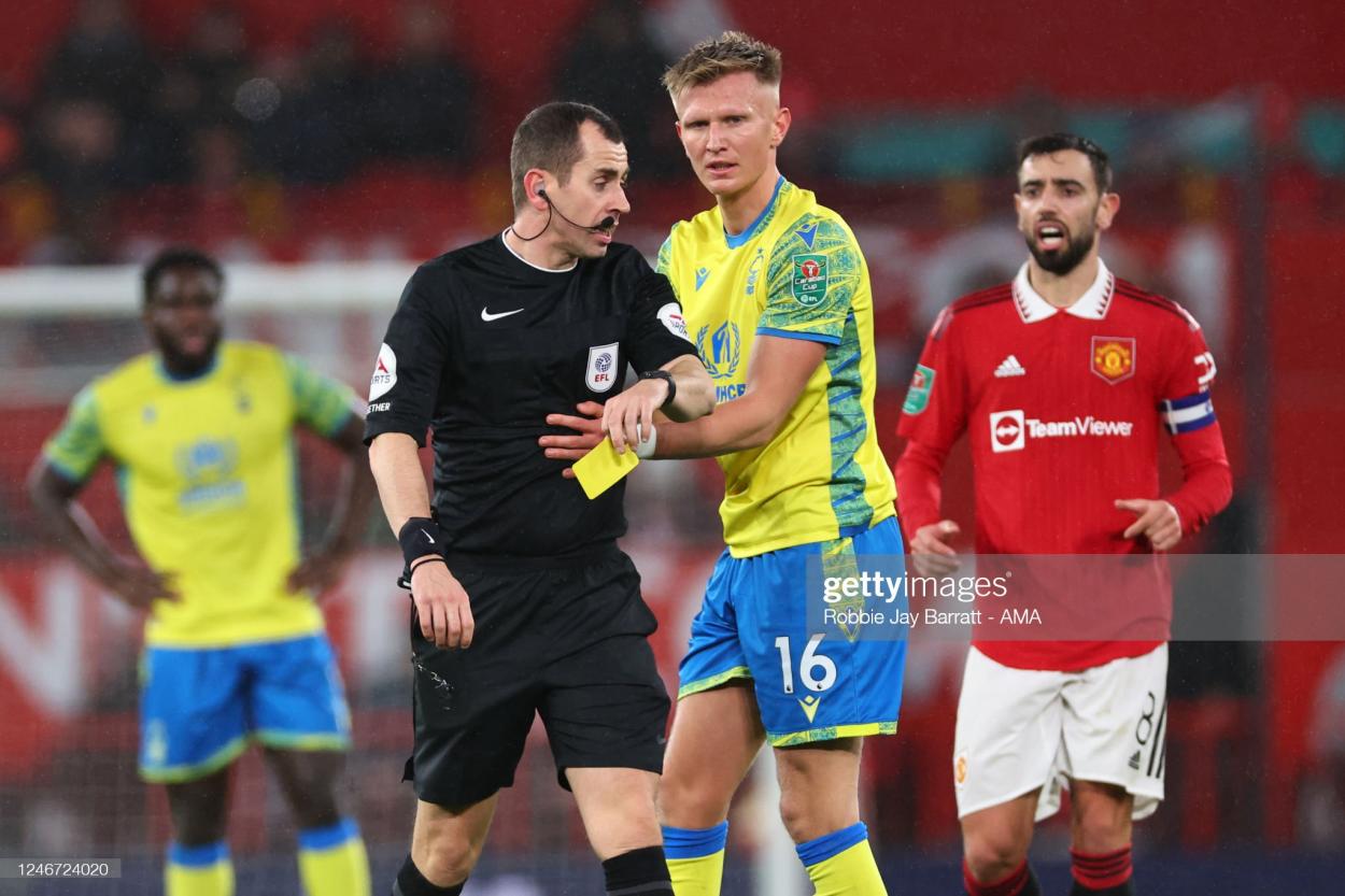 Sam Surridge receiving a yellow card after his harsh tackle. (Photo by Robbie Jay Barratt - AMA/Getty Images)  