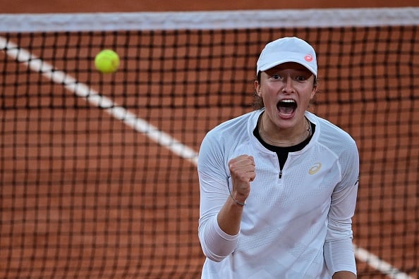 Poland's Iga Swiatek celebrates the biggest win of her career, after dumping out former champion, Simona Halep (Julian Finney/Getty Images)