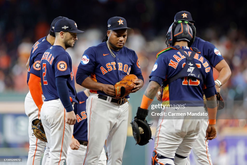 Framber Valdez #59 of the Houston Astros talks with his team on the mound prior to being relieved against the Texas Rangers during the third inning in Game Two of the American League Championship Series at Minute Maid Park on October 16, 2023 in Houston, Texas. (Photo by Carmen Mandato/Getty Images)