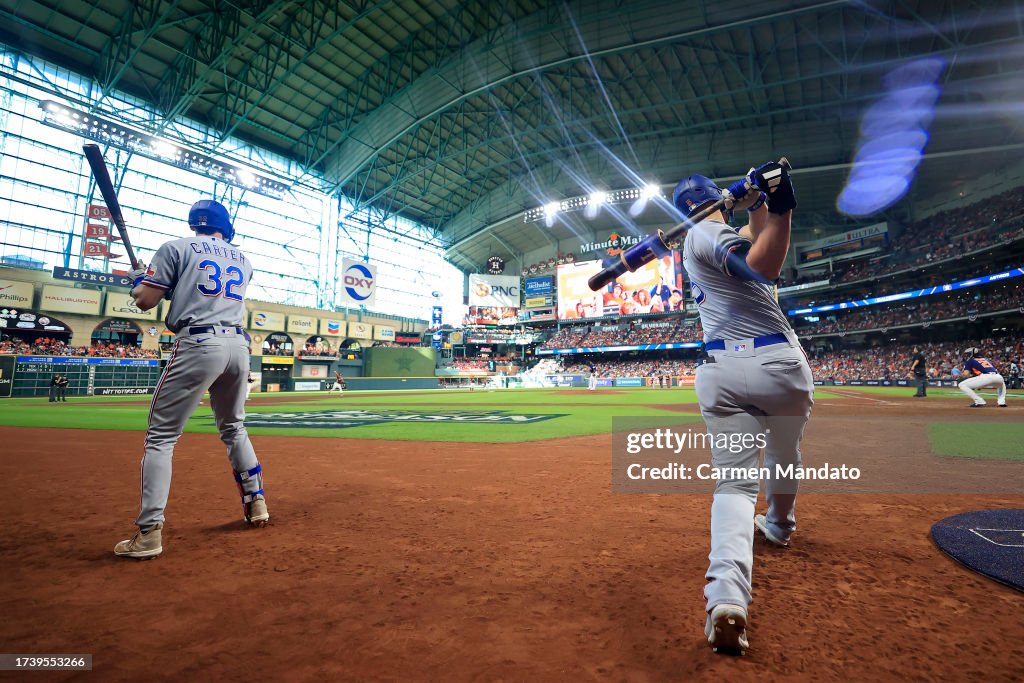  Evan Carter #32 and Corey Seager #5 of the Texas Rangers warm up on deck against the Houston Astros during the fifth inning in Game Two of the American League Championship Series at Minute Maid Park on October 16, 2023 in Houston, Texas. (Photo by Carmen Mandato/Getty Images)