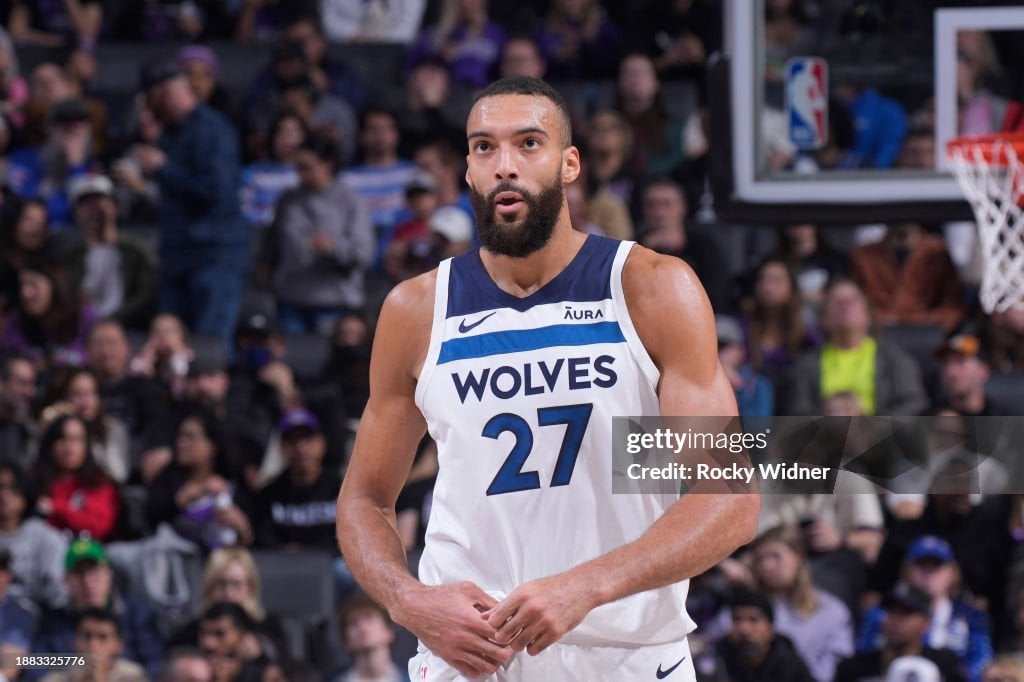 Rudy Gobert #27 of the Minnesota Timberwolves looks on during the game against the Sacramento Kings on December 23, 2023 at Golden 1 Center in Sacramento, California. NOTE TO USER: User expressly acknowledges and agrees that, by downloading and or using this photograph, User is consenting to the terms and conditions of the Getty Images Agreement. Mandatory Copyright Notice: Copyright 2023 NBAE (Photo by Rocky Widner/NBAE via Getty Images)