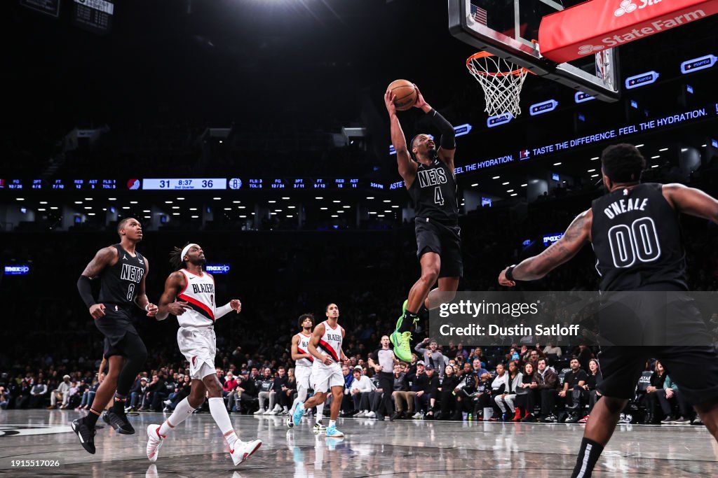  Dennis Smith Jr. #4 of the Brooklyn Nets dunks the ball during the second quarter of the game against the Portland Trail Blazers at Barclays Center on January 07, 2024 in New York City. NOTE TO USER: User expressly acknowledges and agrees that, by downloading and or using this photograph, User is consenting to the terms and conditions of the Getty Images License Agreement. (Photo by Dustin Satloff/Getty Images)