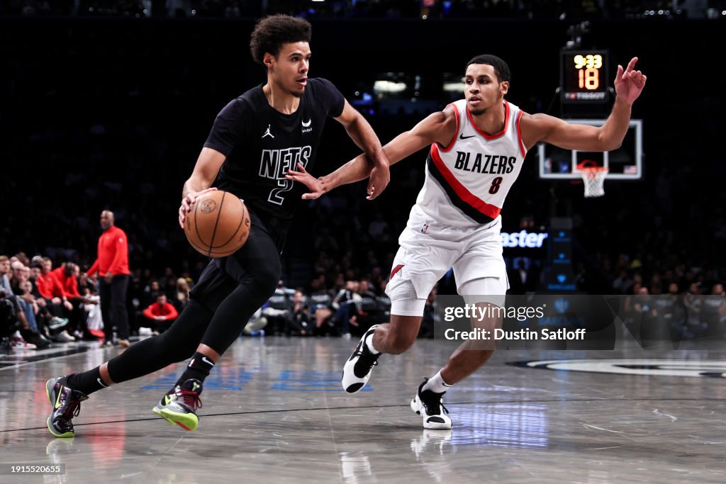 Cameron Johnson #2 of the Brooklyn Nets is guarded by Kris Murray #8 of the Portland Trail Blazers during the second quarter of the game at Barclays Center on January 07, 2024 in New York City. NOTE TO USER: User expressly acknowledges and agrees that, by downloading and or using this photograph, User is consenting to the terms and conditions of the Getty Images License Agreement. (Photo by Dustin Satloff/Getty Images)
