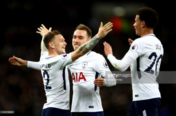 Kieran Trippier, Christian Eriksen, and Dele Alli celebrate Phil Jones' own goal. (Photo credit: Julian Finney/Getty Images)