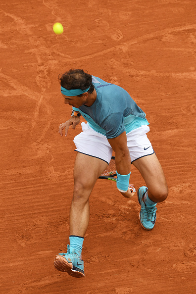 Rafael Nadal slaps a tweener up the line for a winner in his first round match victory at the 2016 French Open