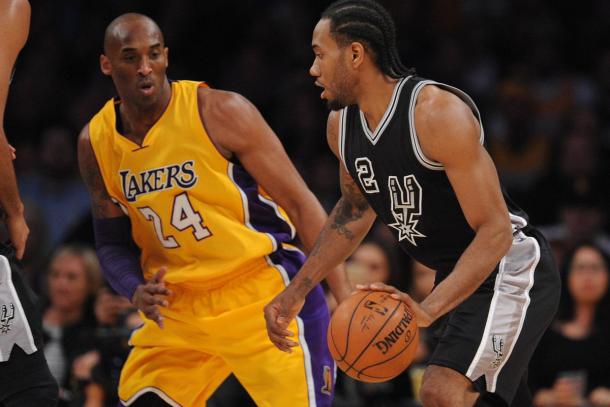 January 22, 2016; Los Angeles, CA. Kawhi Leonard (2) of the San Antonio Spurs driving against Los Angeles Lakers forward Kobe Bryant (24). |Gary A. Vasquez-USA TODAY Sports|