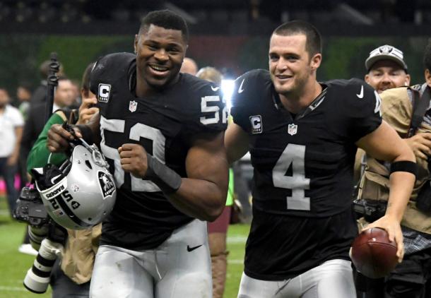 Khalil Mack and Derek Carr celebrate after a NFL International Series game against the Houston Texans at Estadio Azteca |Nov 21, 2016, Source: Kirby Lee-USA TODAY Sports|