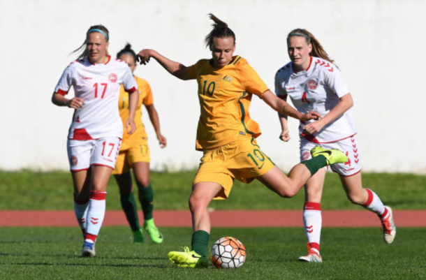 Australian midfielder Emily van Egmond sends the ball in a match against Denmark at the Algarve Cup. | Photo: Octavio Passos - Getty Images