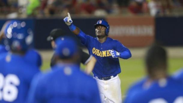 Colombia's Dilson Herrera celebrates after hitting a solo home run in the 8th inning during a World Baseball Classic qualifying championship game against Panama in Panama City, Sunday, March 20, 2016. (AP Photo/Arnulfo Franco)