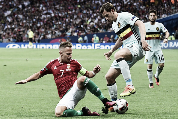 Above: Jan Vertonghen avoiding the challenge of   Balazs Dzsudzsak in Belgium's 4-0 win over Hungary 