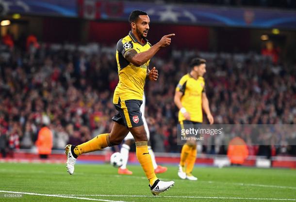 Walcott celebrates one of two goals he scored against Basel in the Champions League | Photo: Getty.