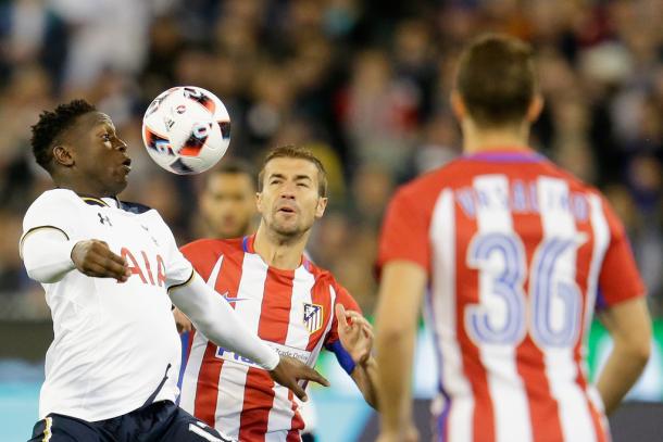 Wanyama battles for possession against Atletico (photo; Getty)