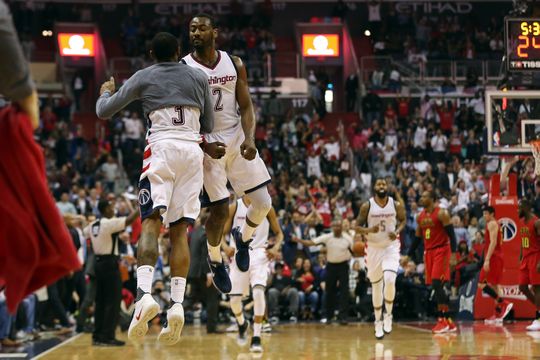 Washington Wizards guard John Wall (2) celebrating with Wizards guard Bradley Beal (3). Photo by: Geoff Burke-USA TODAY Sports 