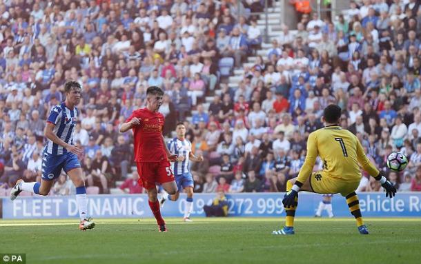 Woodburn tucks a chance away against Wigan (photo: PA)