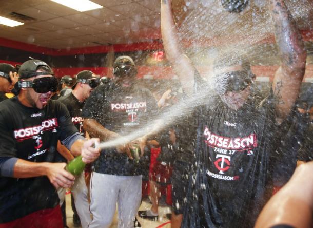 Twins players celebrate after clinching their first playoff berth since 2010/Photo: Ron Schwane/Associated Press