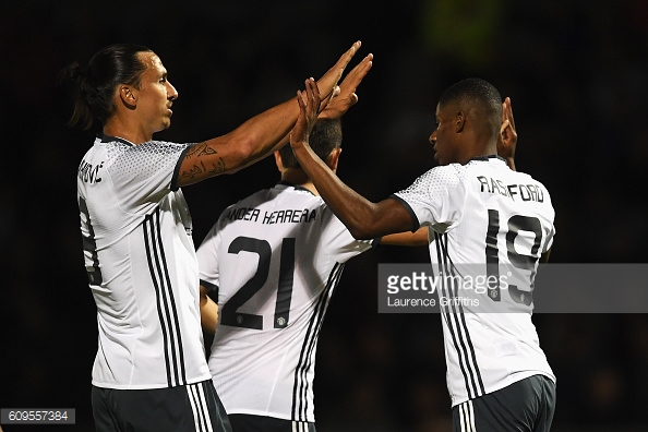 Marcus Rashford celebrating scoring Manchester United's third goal against Northampton with Zlatan Ibrahimovic