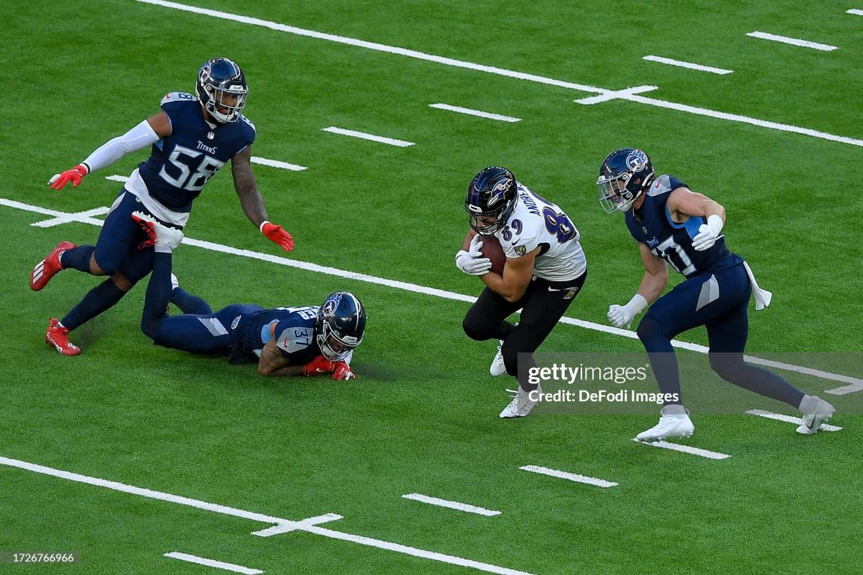 Mark Andrews of Baltimore Ravens battle for the ball during the NFL match between Baltimore Ravens and Tennessee Titans at Tottenham Hotspur Stadium on October 15, 2023 in London, England. (Photo by Vincent Mignott/DeFodi Images via Getty Images)