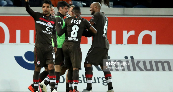 Sami Allagui (left) after scoring his vital goal. | Photo: Christof Koepsel/Bongarts/Getty Images.