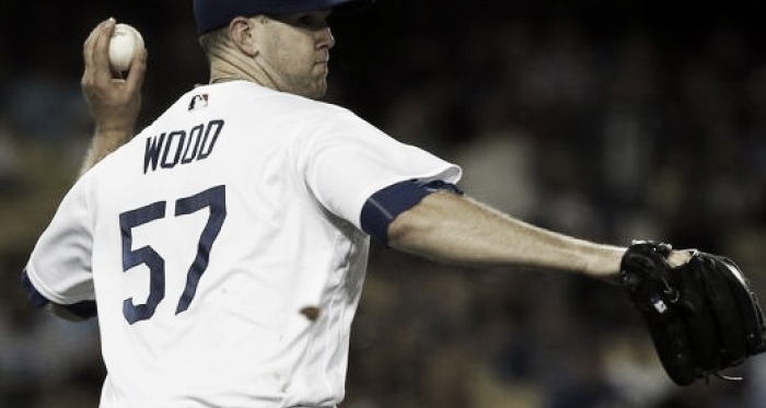 Los Angeles Dodgers pitcher Alex Wood throws to first after fielding a bunt single by Arizona Diamondbacks'Gregor Blanco July 5, 2017. |Source: AP Photo/Alex Gallardo|