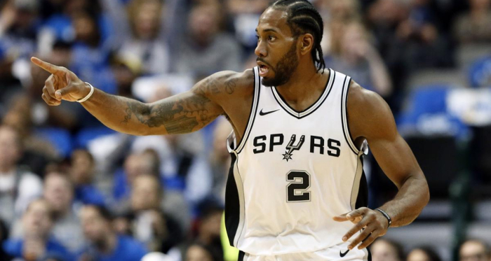 San Antonio Spurs forward Kawhi Leonard (2) celebrates sinking a basket in the first half of an NBA basketball game against the Dallas Mavericks onTuesday, Dec. 12, 2017, in Dallas. |AP Photo/Tony Gutierrez|