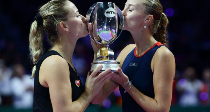 Babos and Mladenovic with their WTA Finals Martina Navratilova trophy | Photo: Suhaimi Abdullah