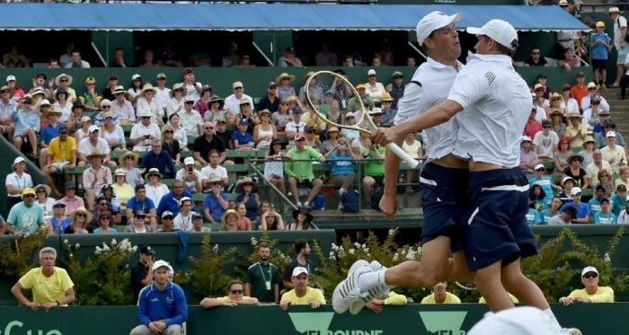 The Bryans with their trademark chest bump in celebration of their Davis Cup win against Australia/Photo: AFP