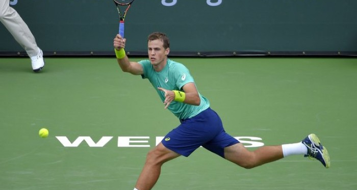 Vasek Pospisil hits a forehand in first round match at Indian Wells. | Photo: BNP Paribas Open