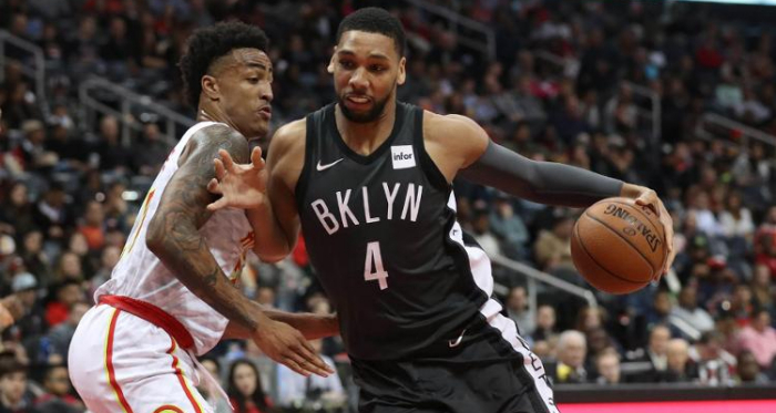 Brooklyn Nets center Jahlil Okafor (4) drives against Atlanta Hawks forward John Collins (20) during the fourth quarter at Philips Arena. |Jason Getz-USA TODAY Sports|