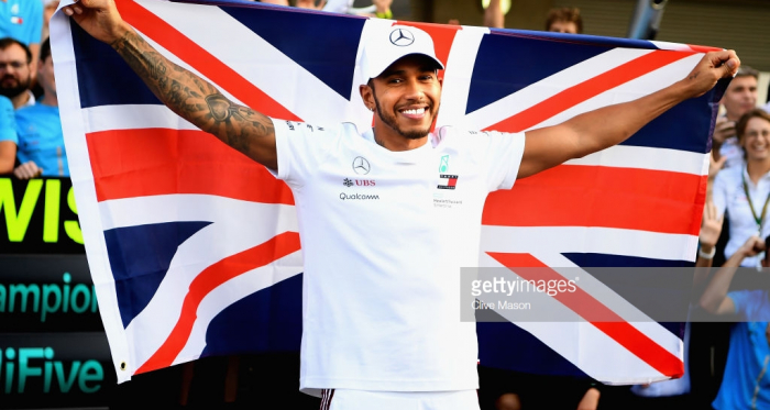 Hamilton celebrating his title success credit: @getty images