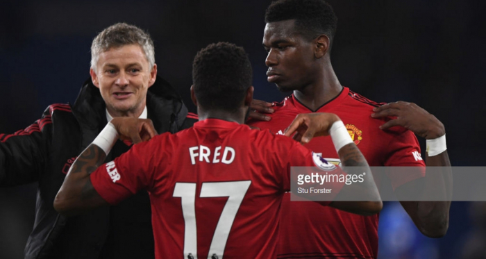 Solskjaer, Pogba, and Fred celebrate after the win at Cardiff City (Photo by Stu Forster/Getty Images)