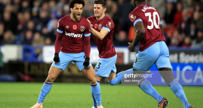 Felipe Anderson celebrates after scoring an equaliser against Huddersfield.