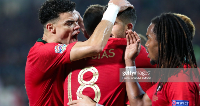 Portugal's Andre Silva celebrates his opening goal in the company of his teammates.