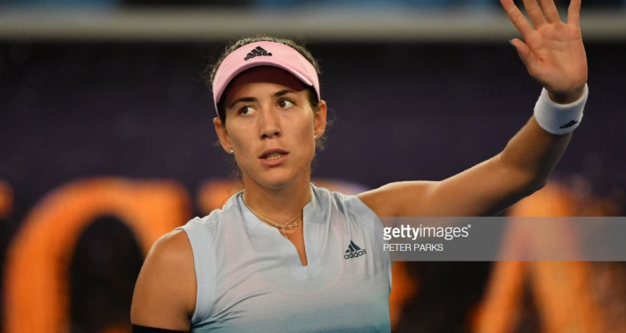 Muguruza waves to the crowd after her late-night victory/Photo: Peter Parks/Getty Images
